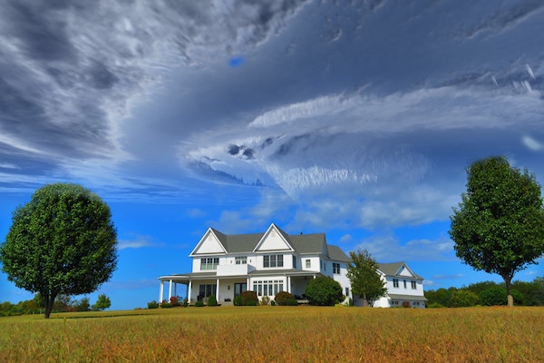 Dark clouds above a house