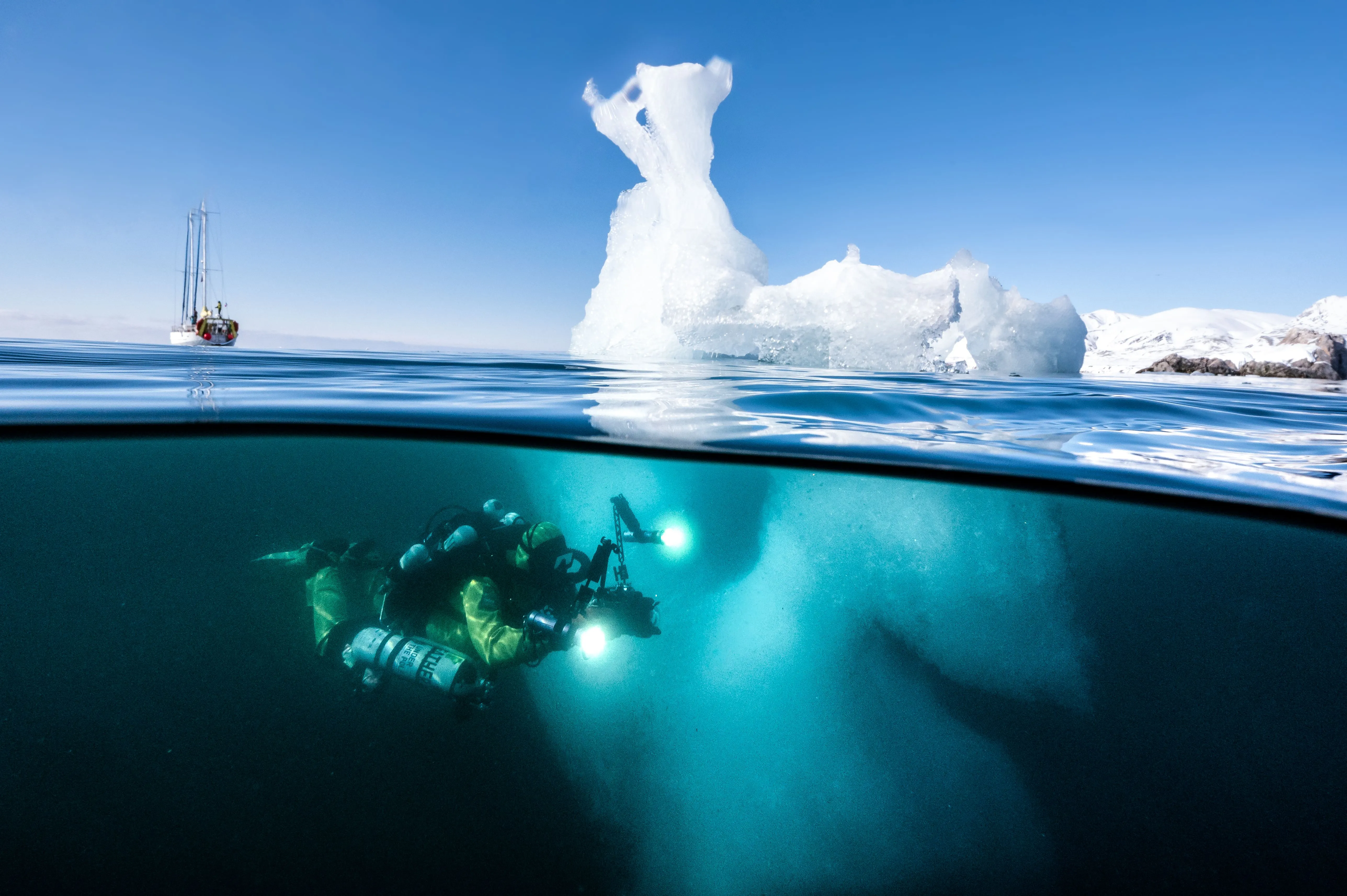 Diver in front of Under the Pole's scientific boat, the Why