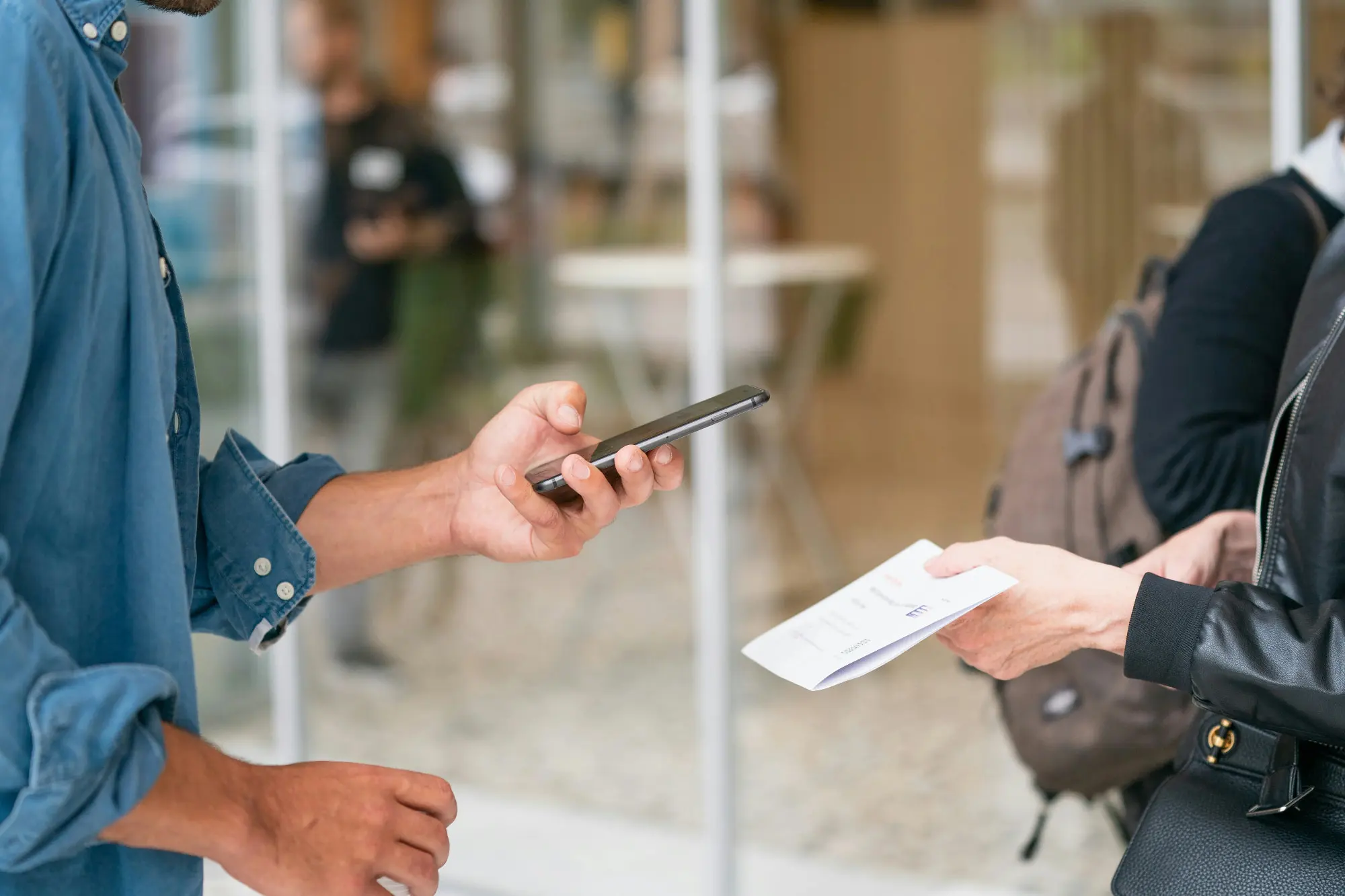 A man scanning a document with his smartphone