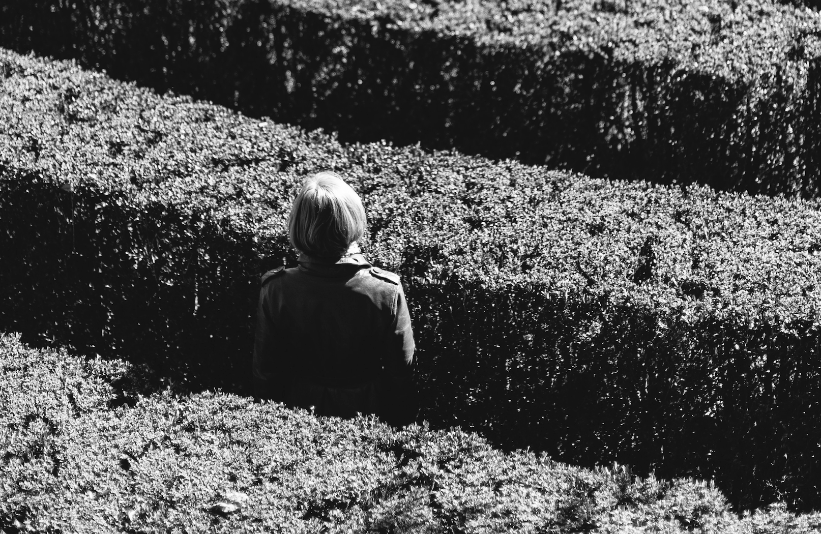 Image of a woman lost in a labyrinth